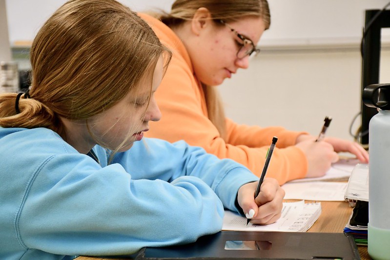 Students writing at school