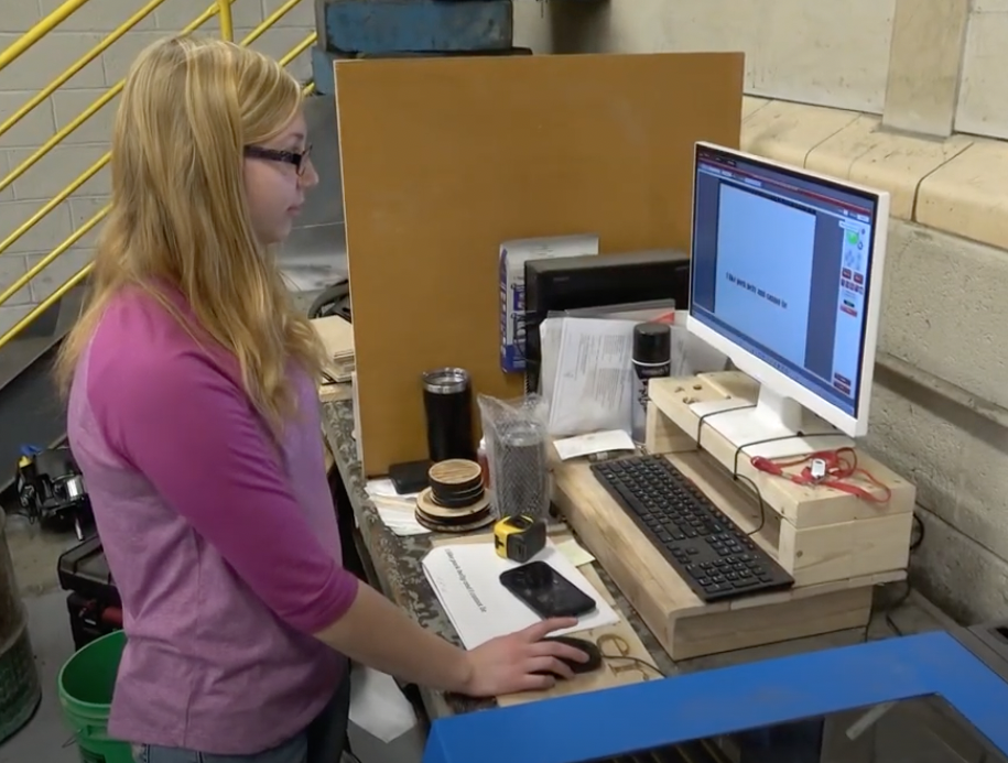 Student working on a computer to engrave