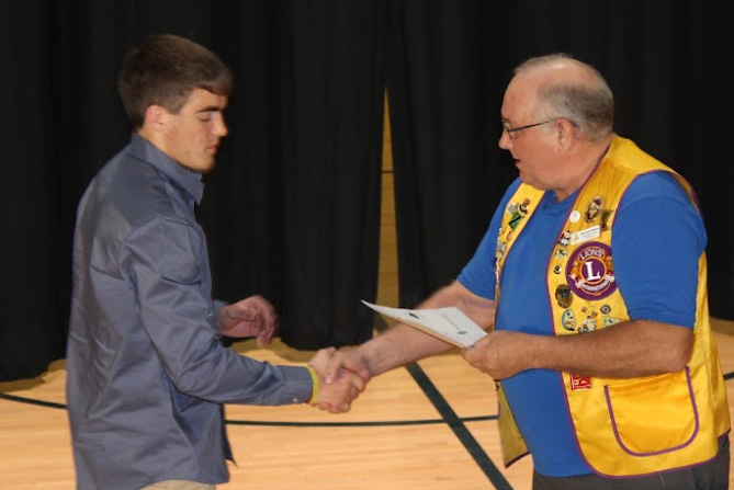 Student receiving community scholarship