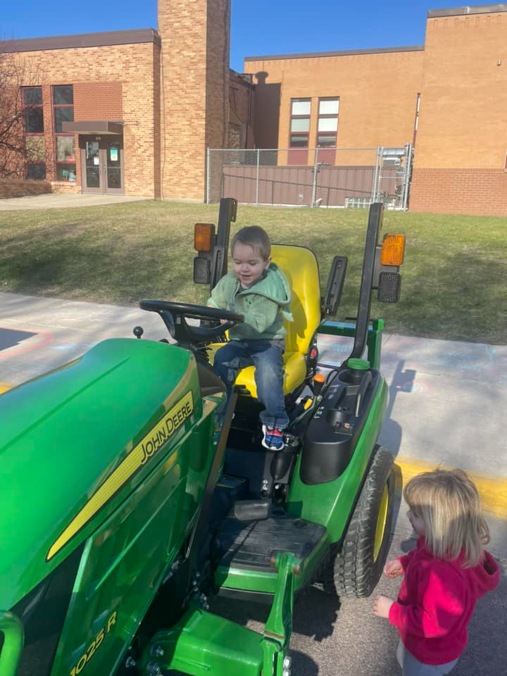 Child driving a tractor