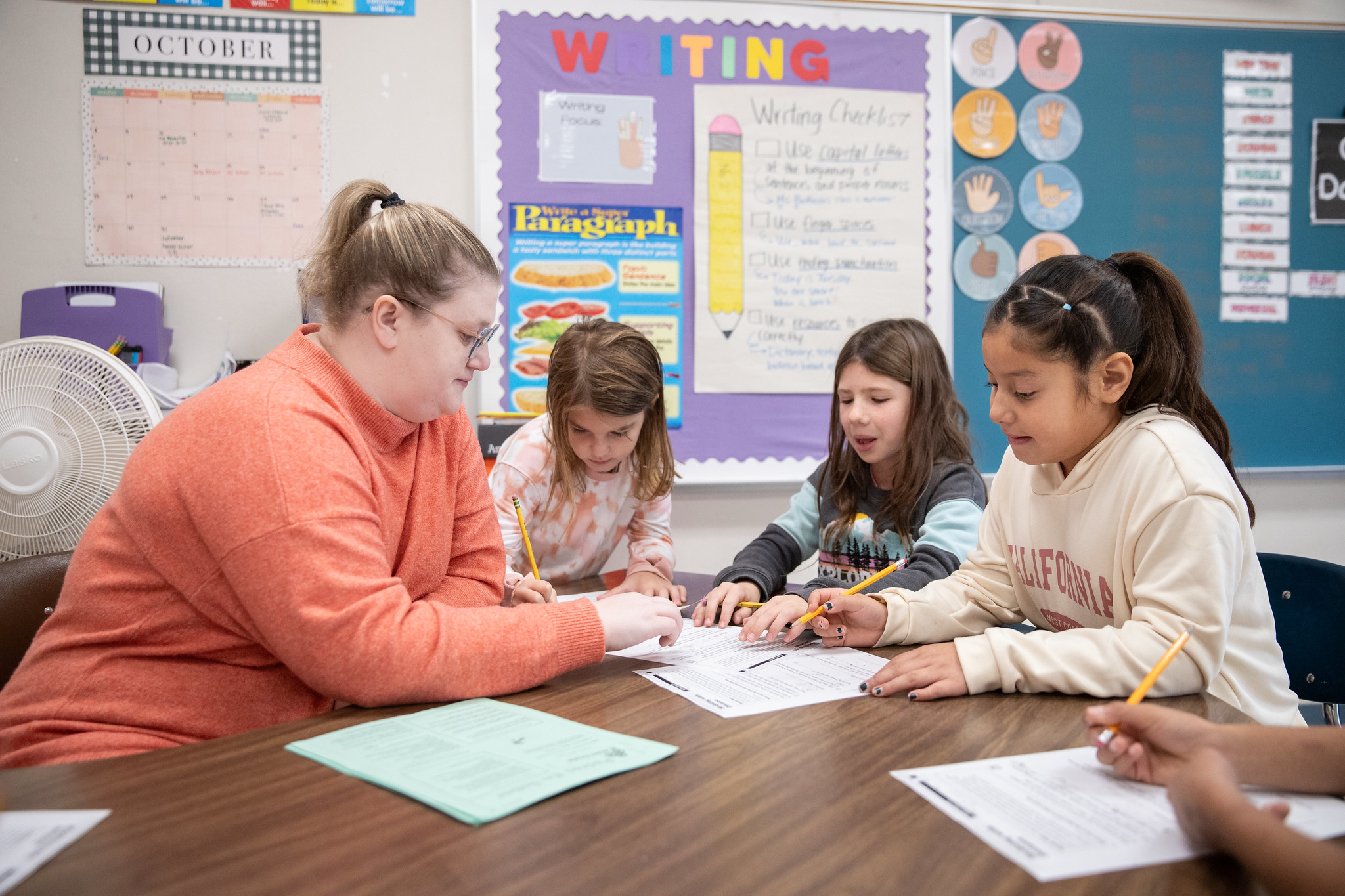 Students working with teacher