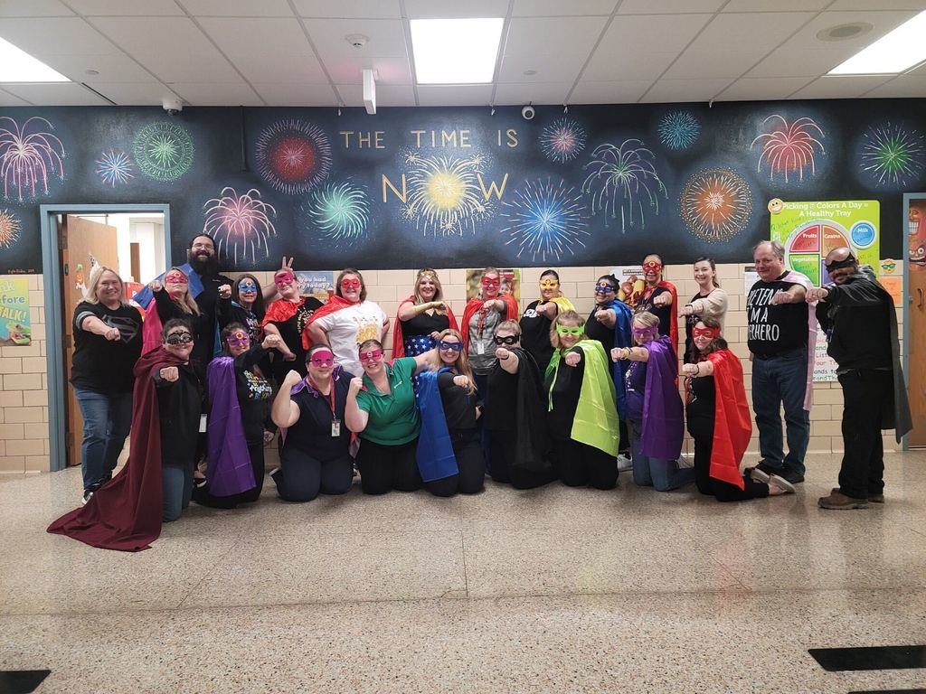 Staff dressed up as super heroes