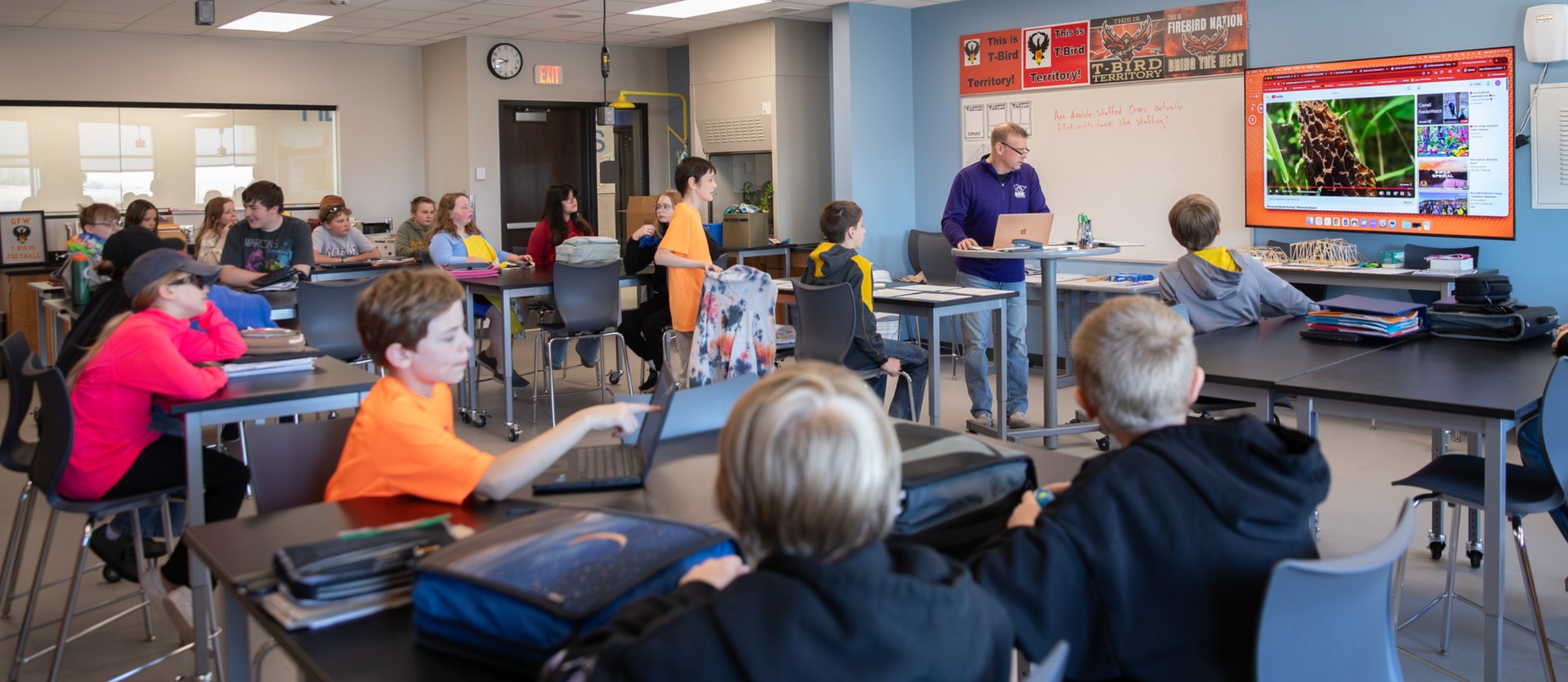 Students in class listening to teacher