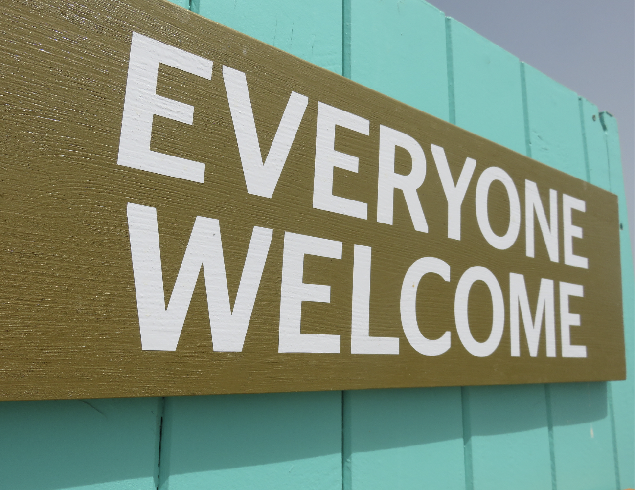 A sign that says "EVERYONE WELCOME"