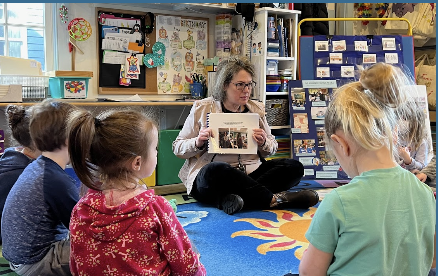 VES Principal Beth Hutchins Reads to Children at local daycare center.