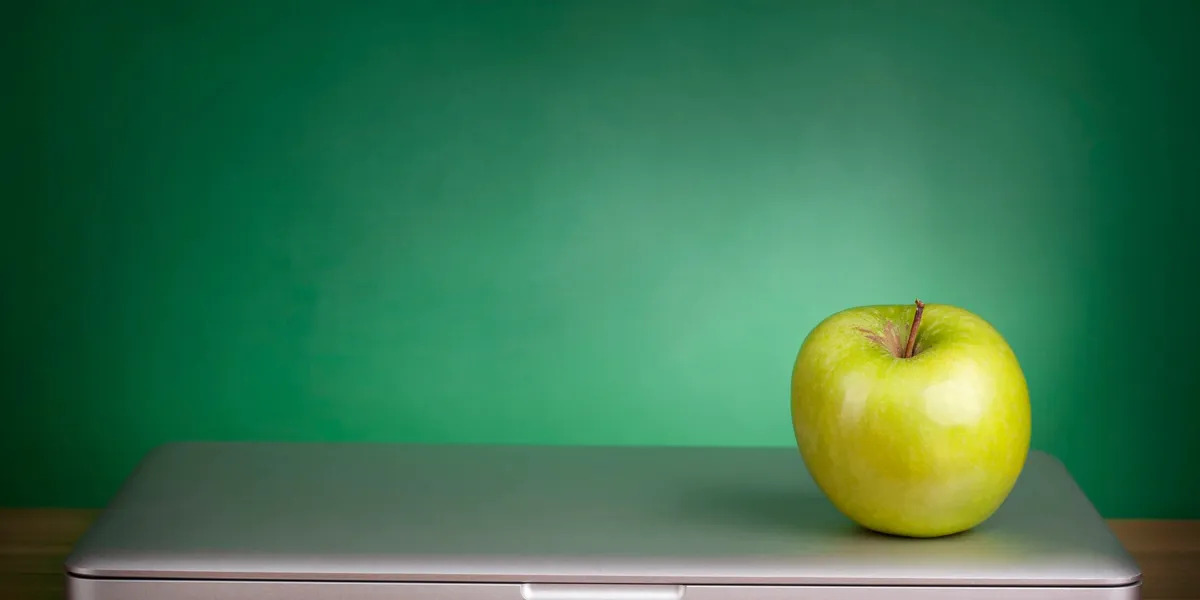 photo of a green background with a green apple