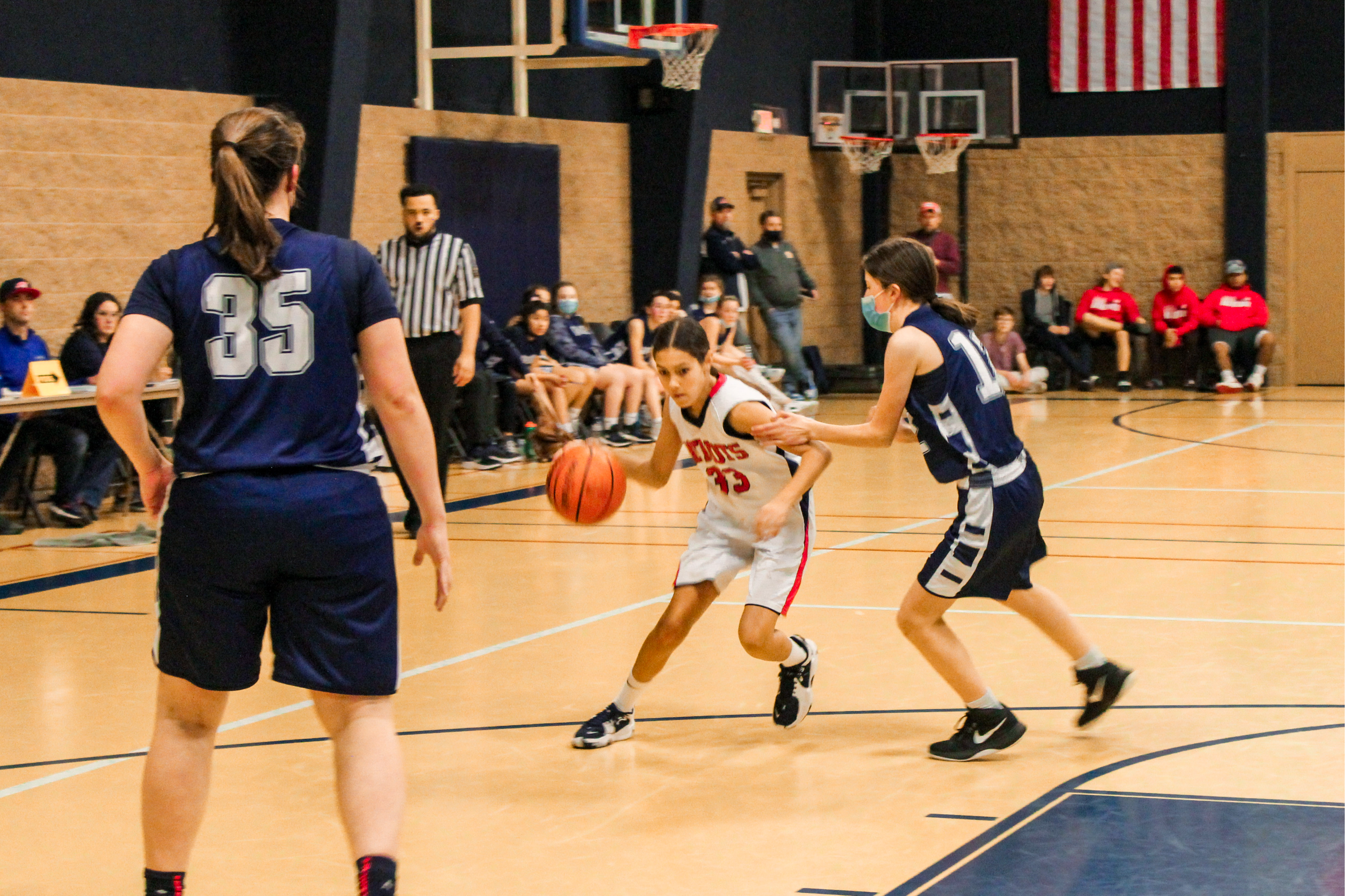 female basketball players posing for a team photo