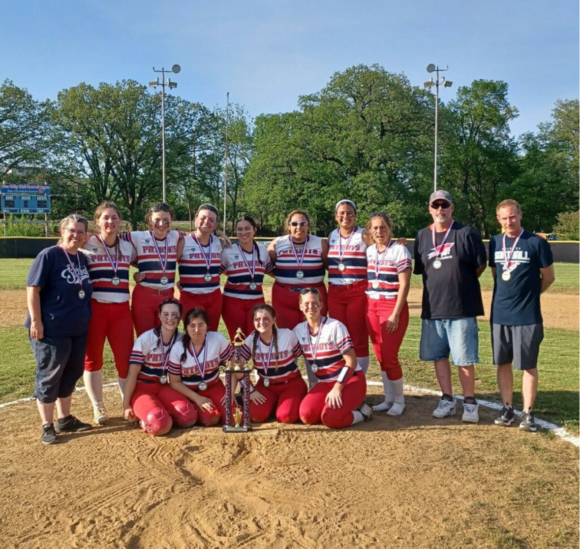 female softball players posing for a team photo