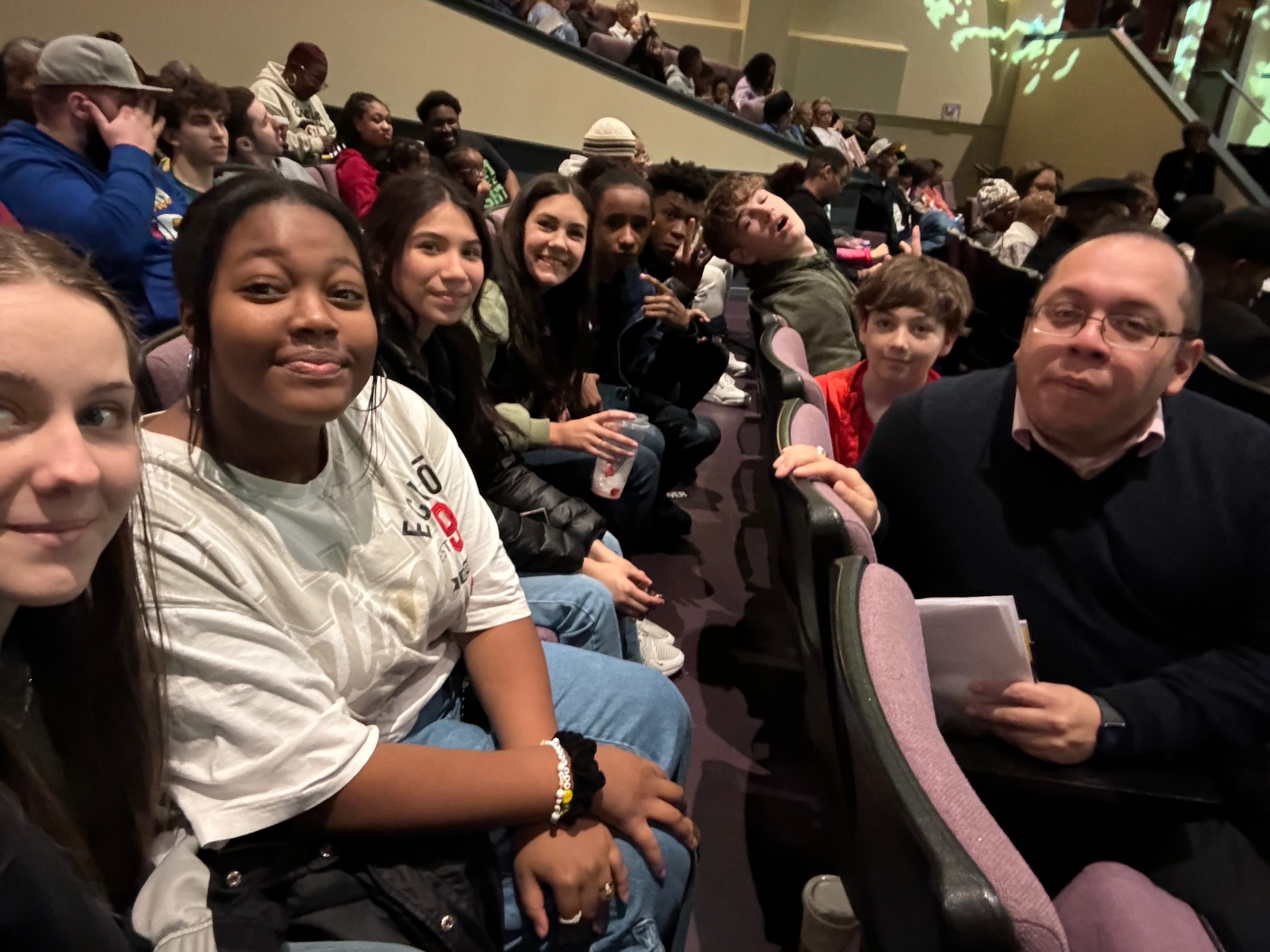 students out at an event together looking at camera for group 