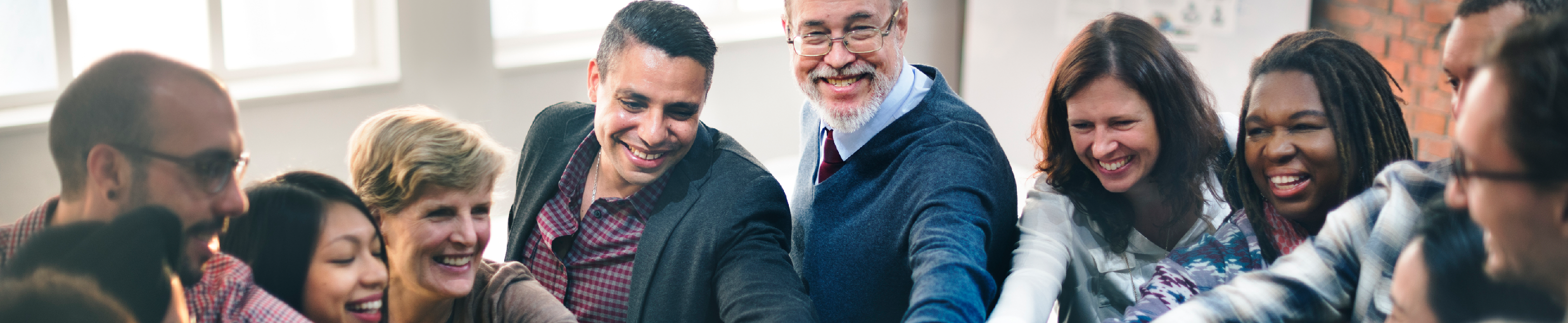 Corporate group huddle.