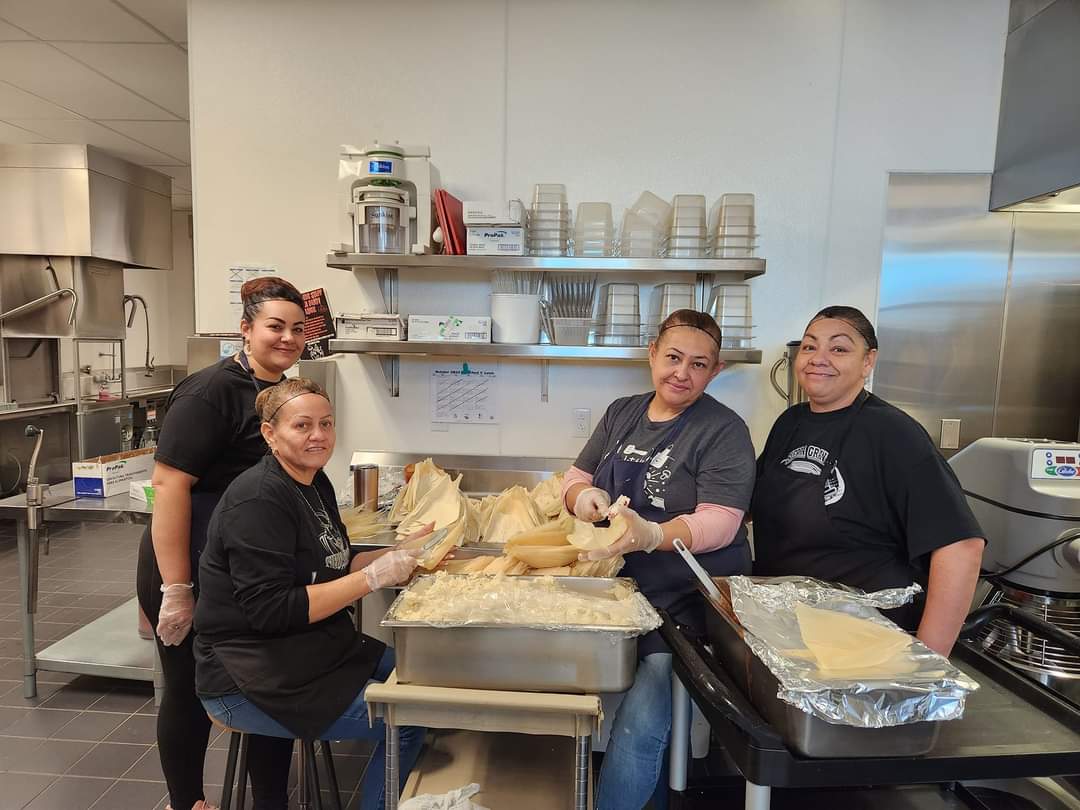 Cafeteria staff preparing tamales