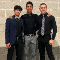 Three students standing for photograph