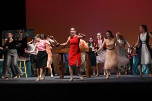 students on stage performing