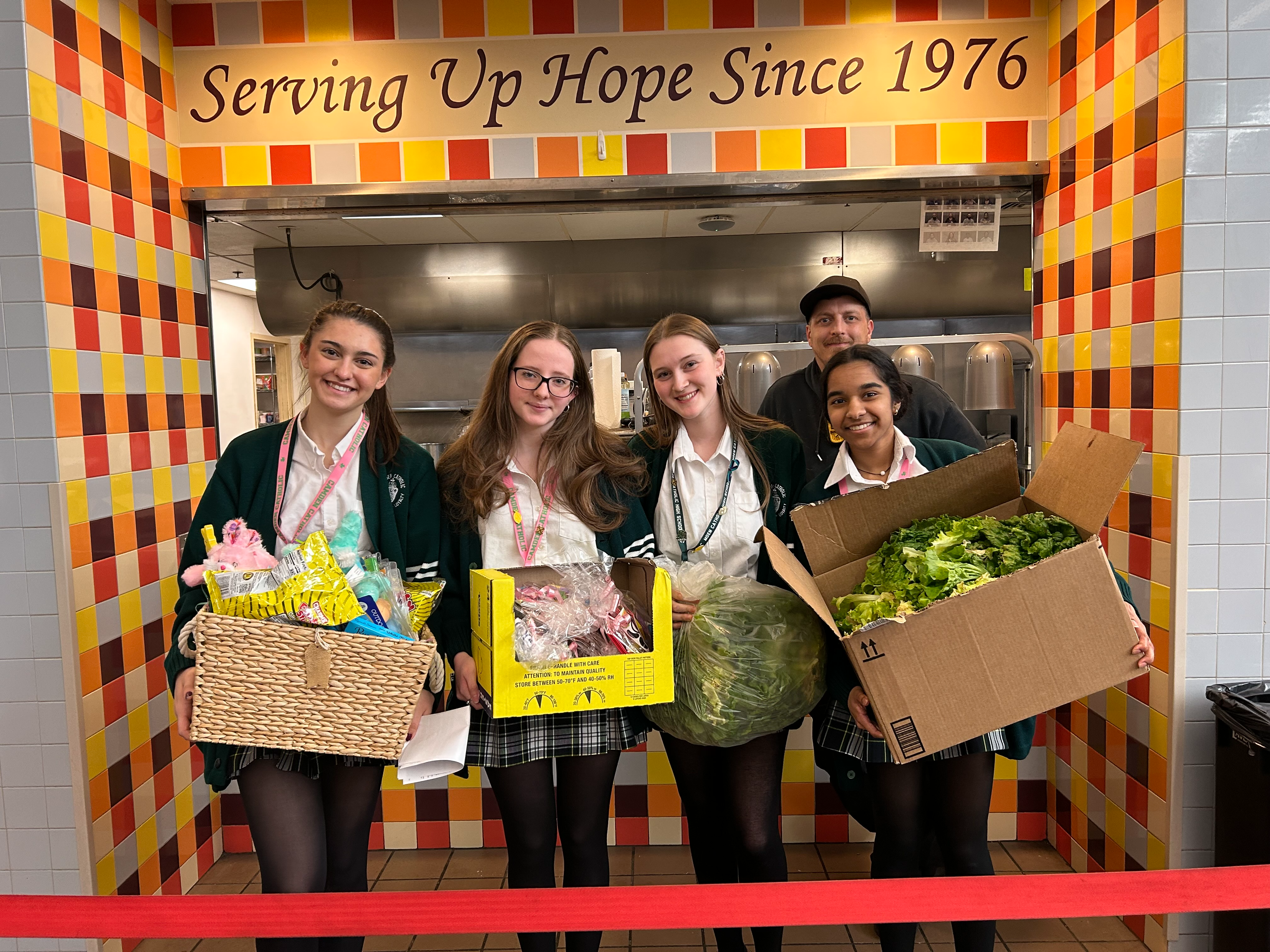students in hallway holding baskets