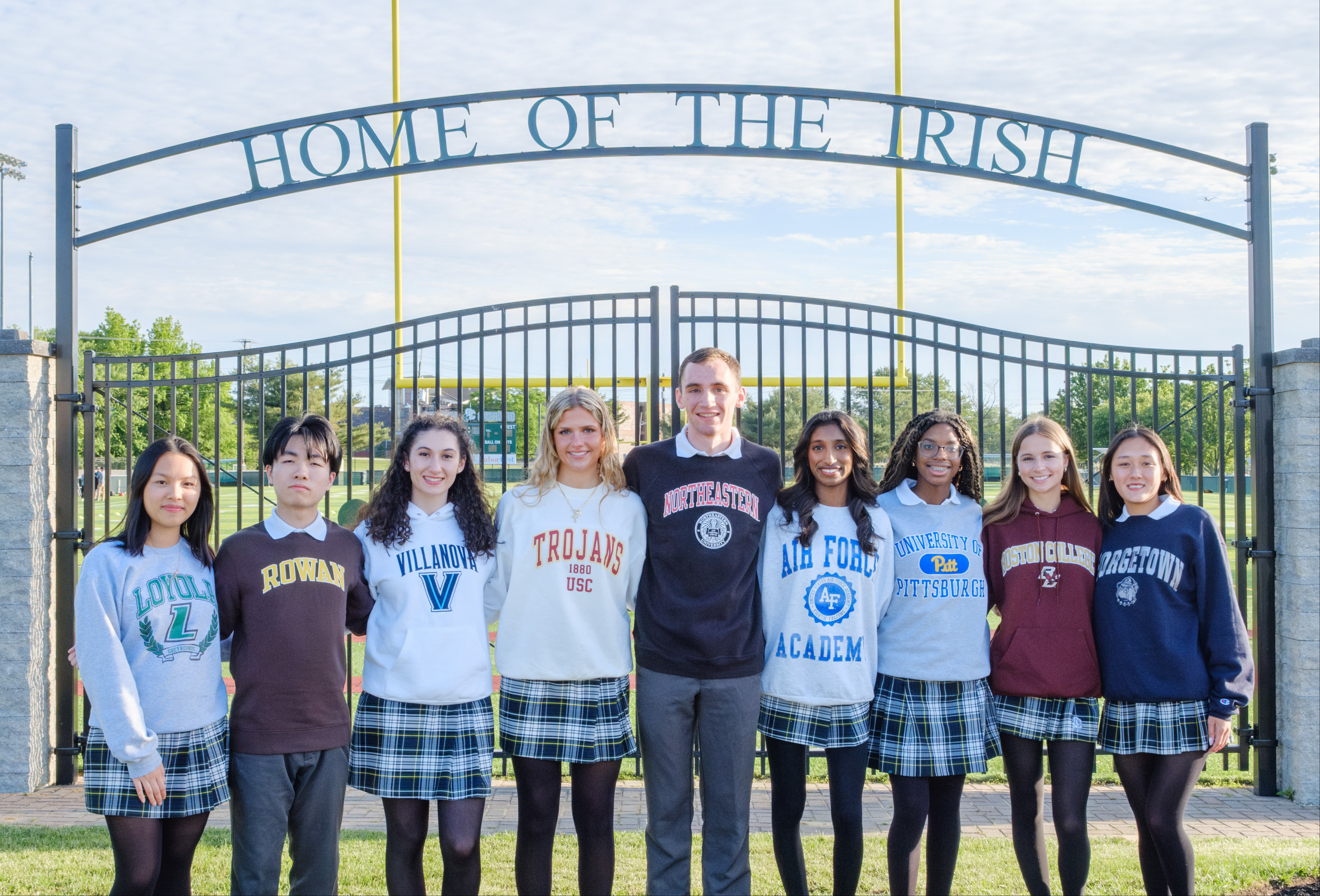 students group picture in field outside