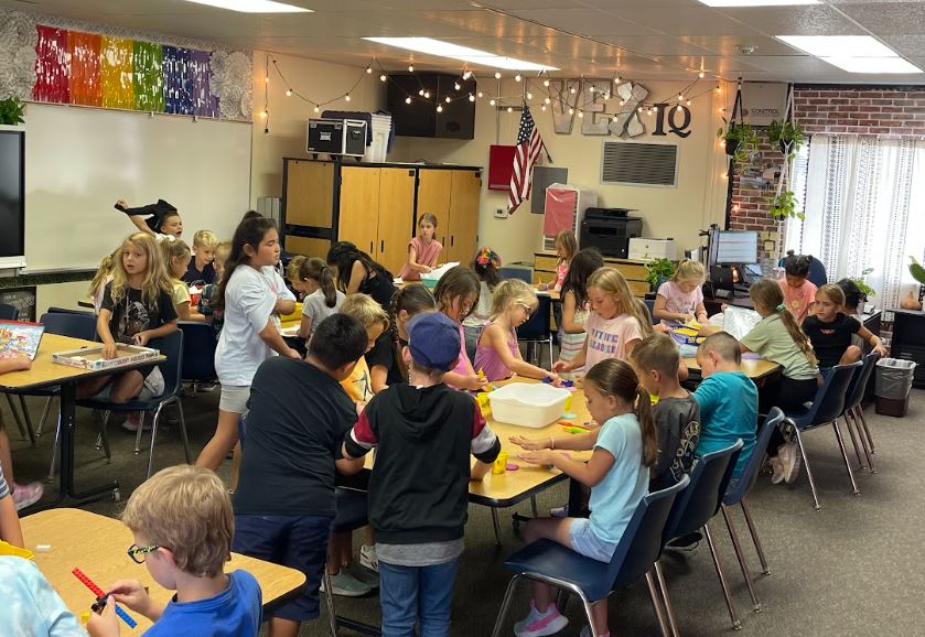 Students playing in a classroom