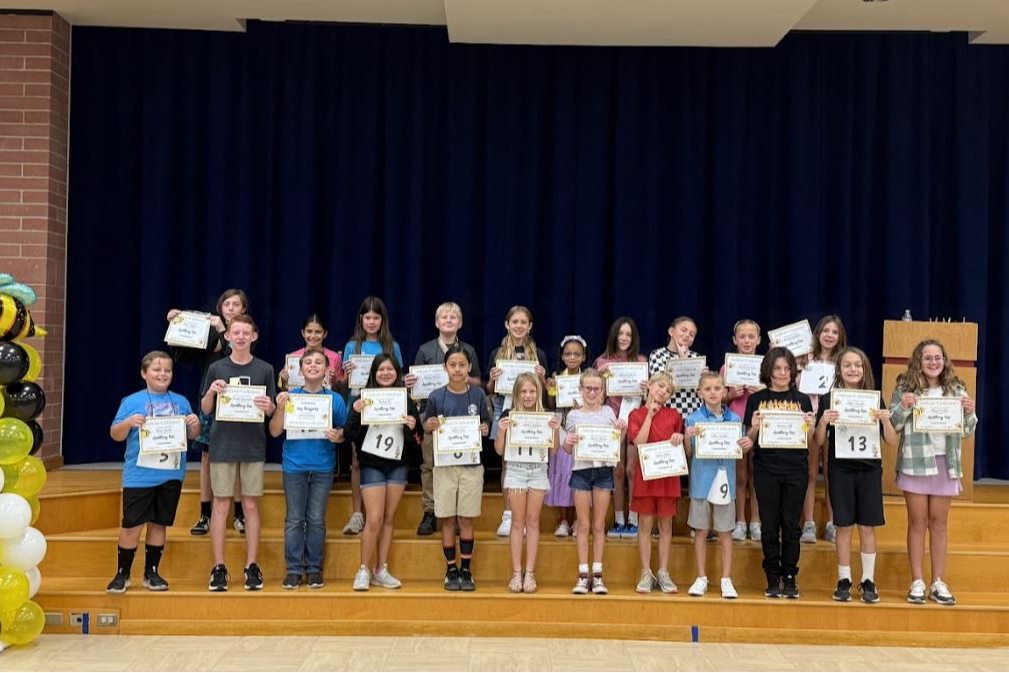 spelling bee participants on stage