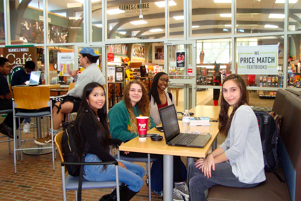 Group of teen girls sitting at the library