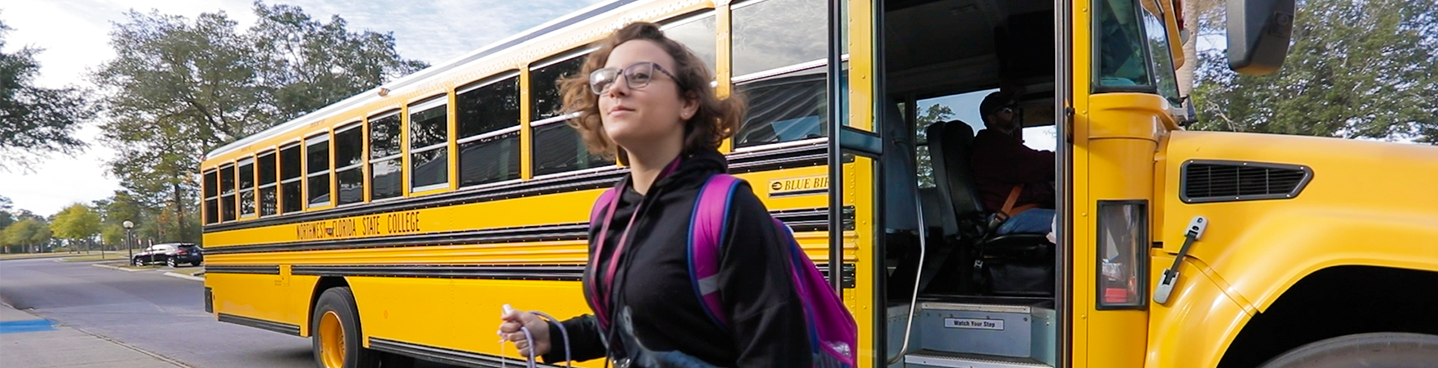 Girl getting off the school bus
