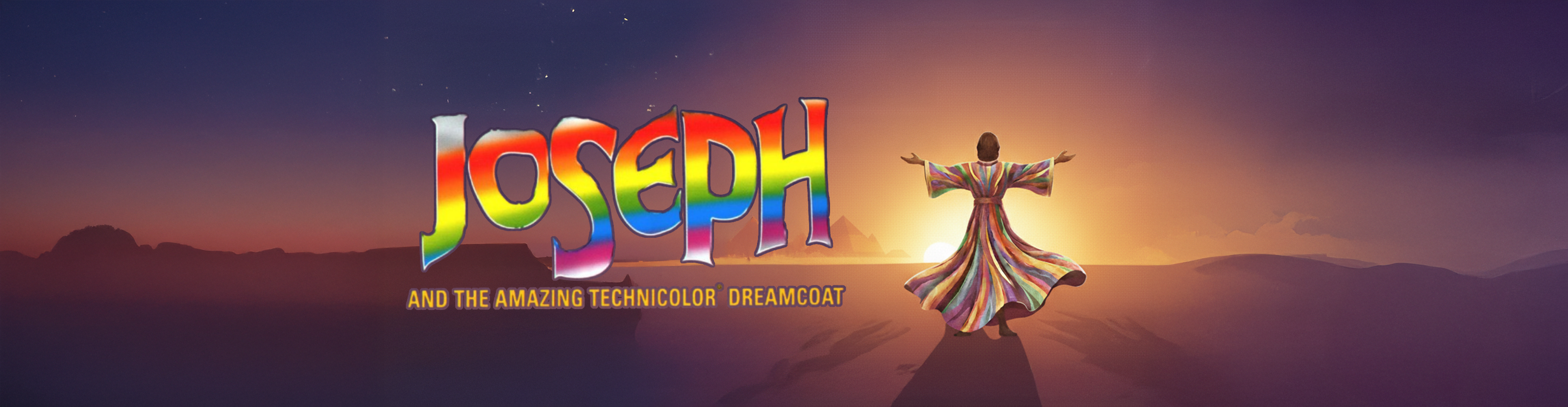 Poster artwork of Joseph in his coat standing in front of the Egyptian desert landscape with pyramids with the title "Joseph and the amazing technicolor dreamcoat"