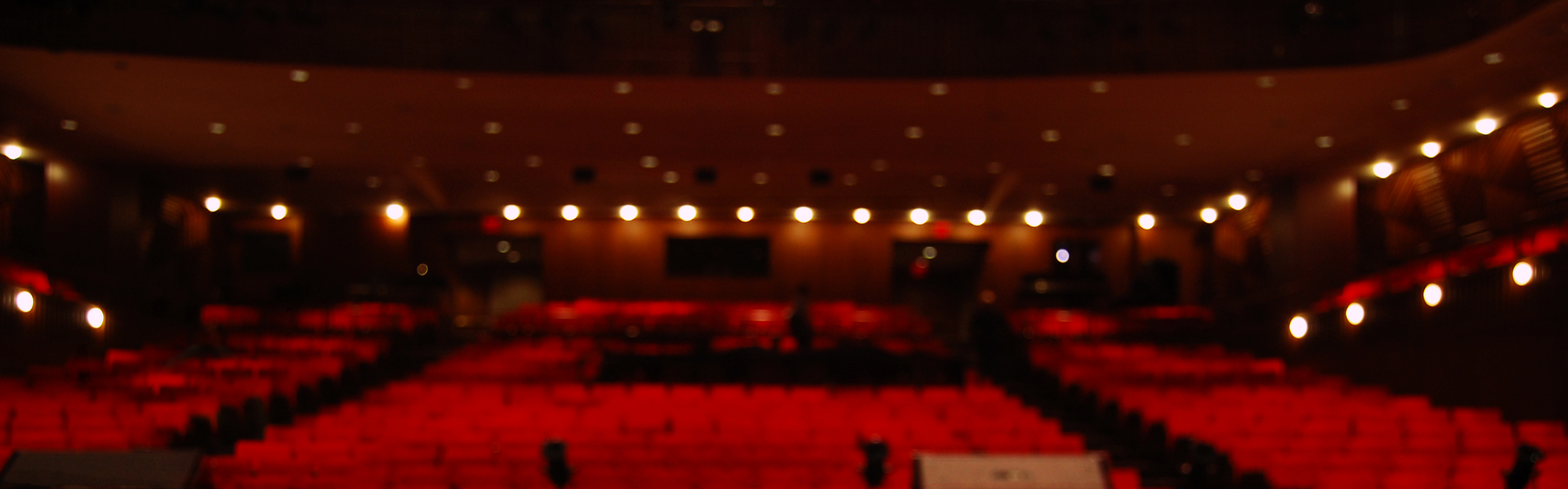Banner showing photo of an empty theatre