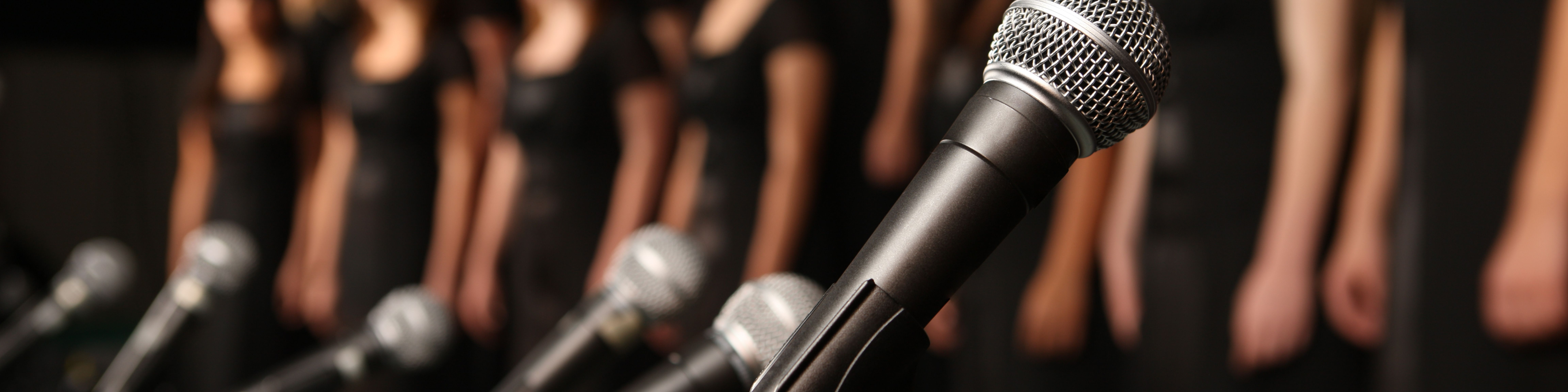 row of choir microphones photograph