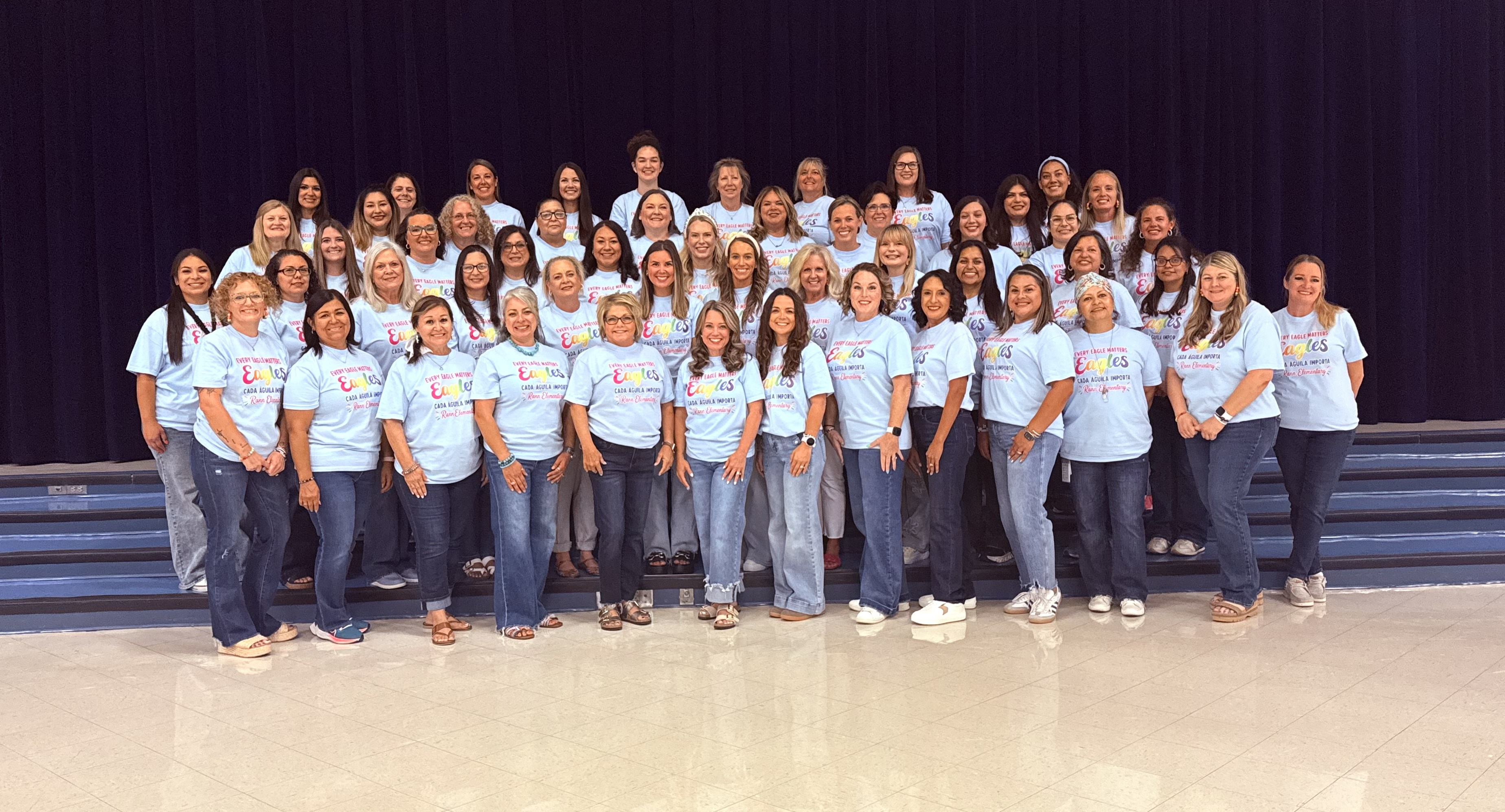 Rann staff picture on the stage steps. 