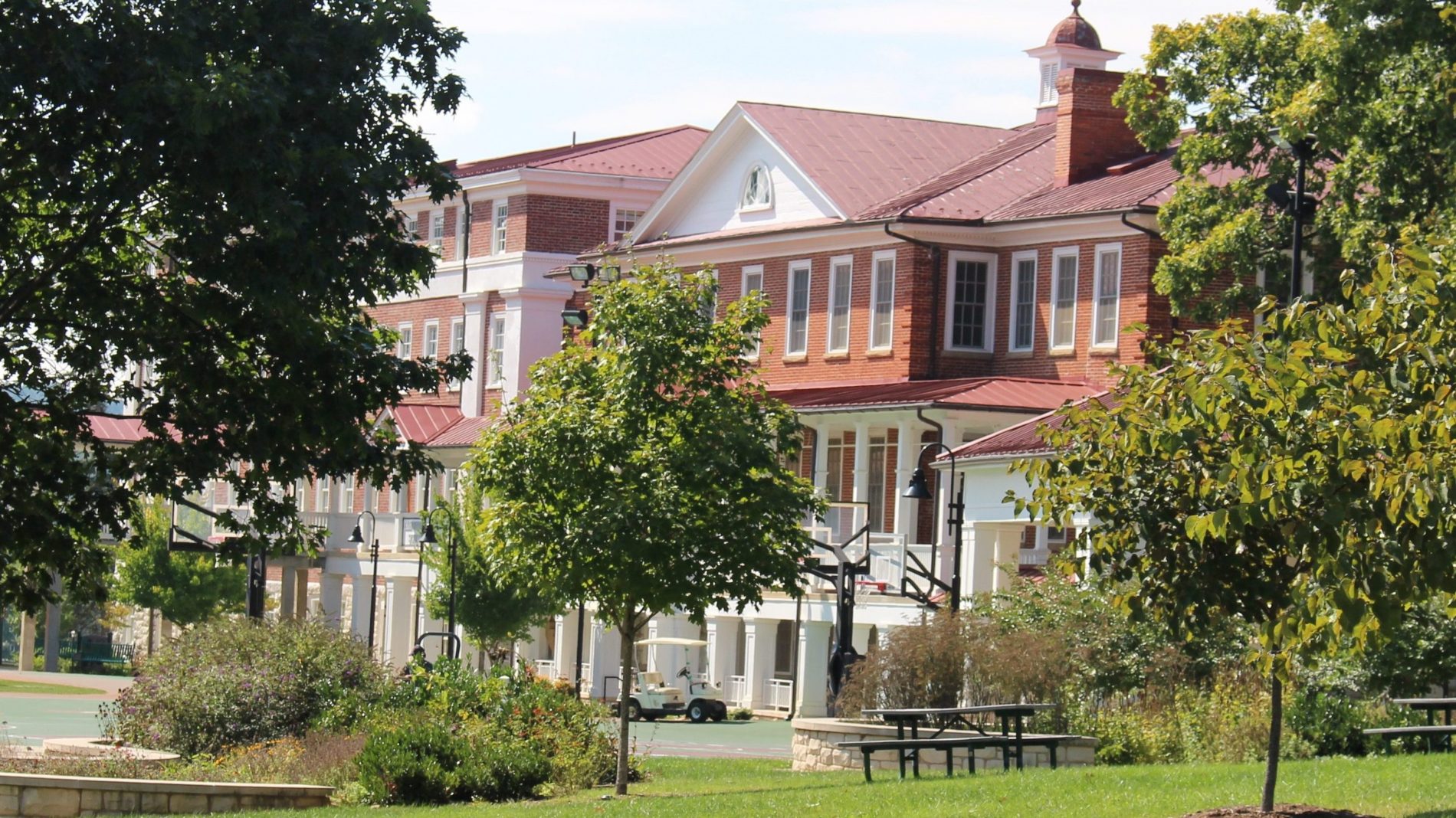 VSDB's Main Hall building and grounds with some trees in front of the building