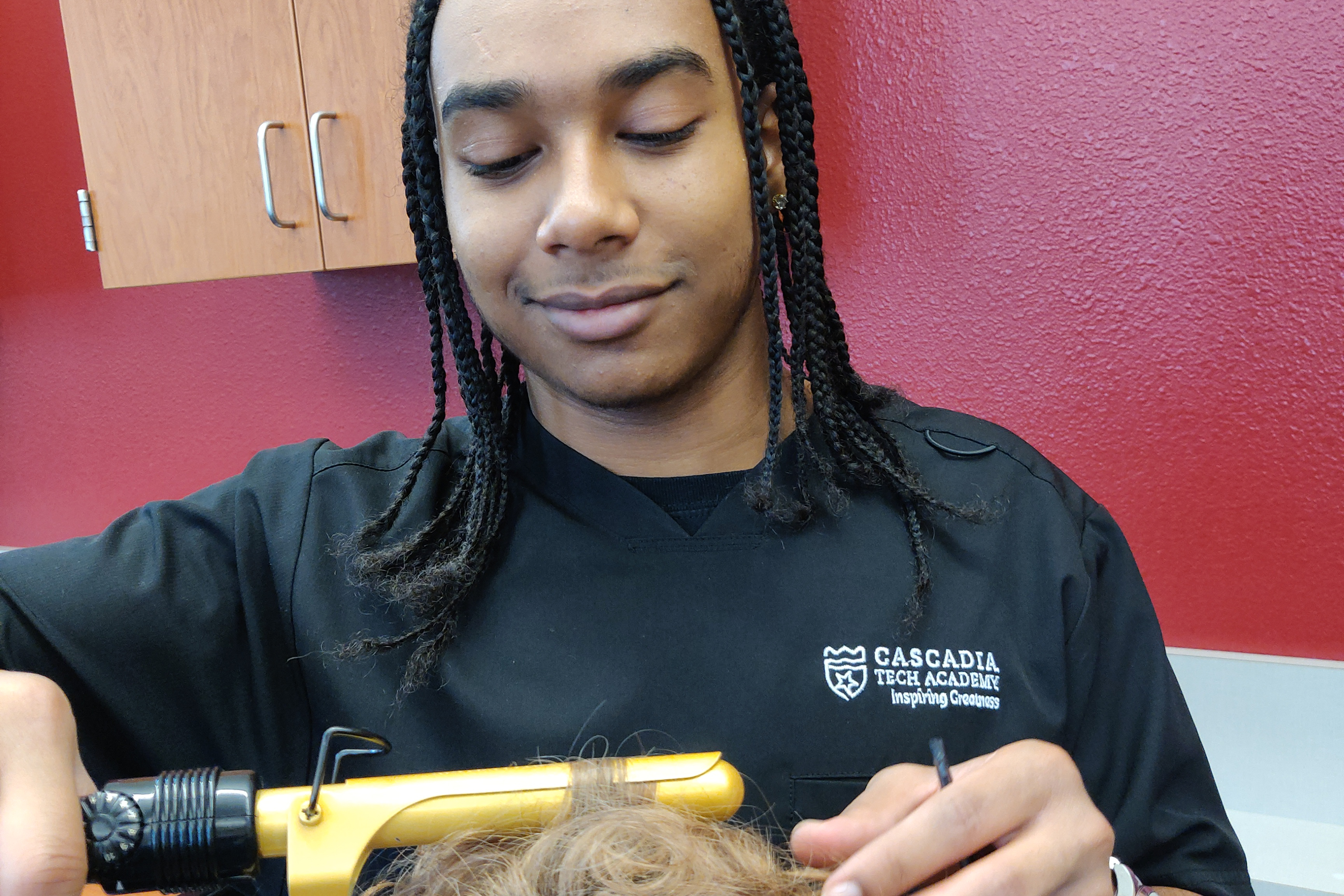 STUDENT USING A CURLING IRON