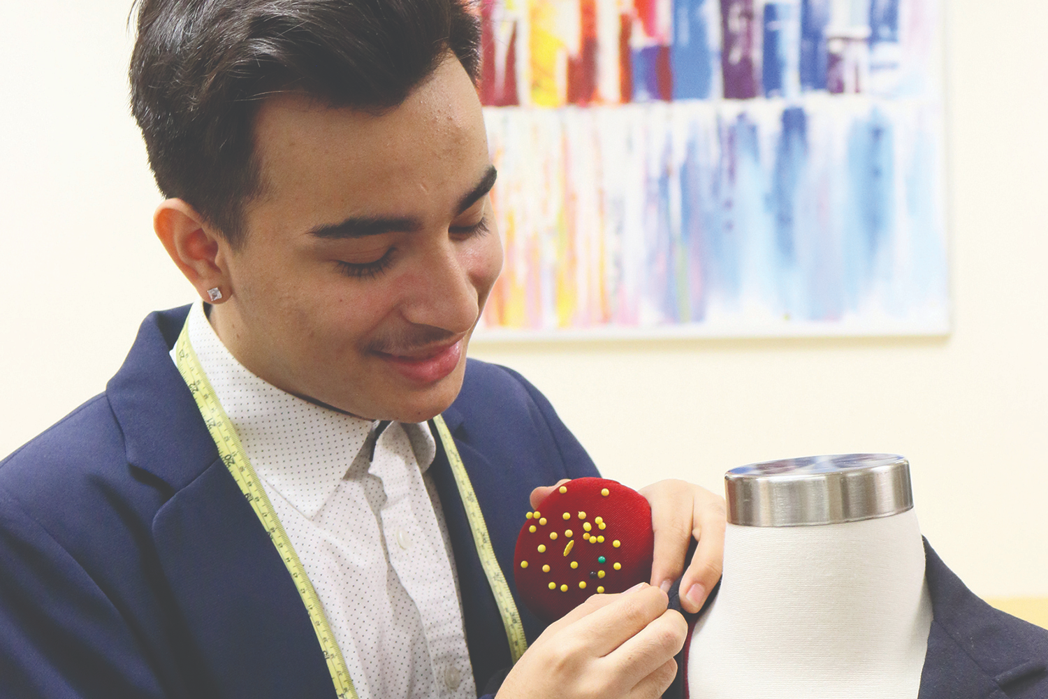 STUDENT PINNING A GARMENT