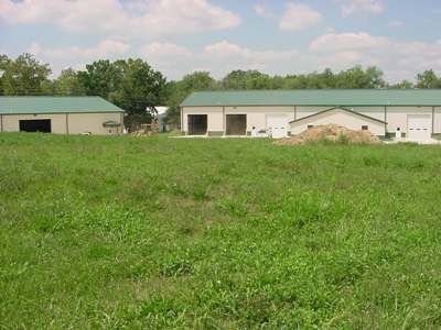 public works facility building in grassy field