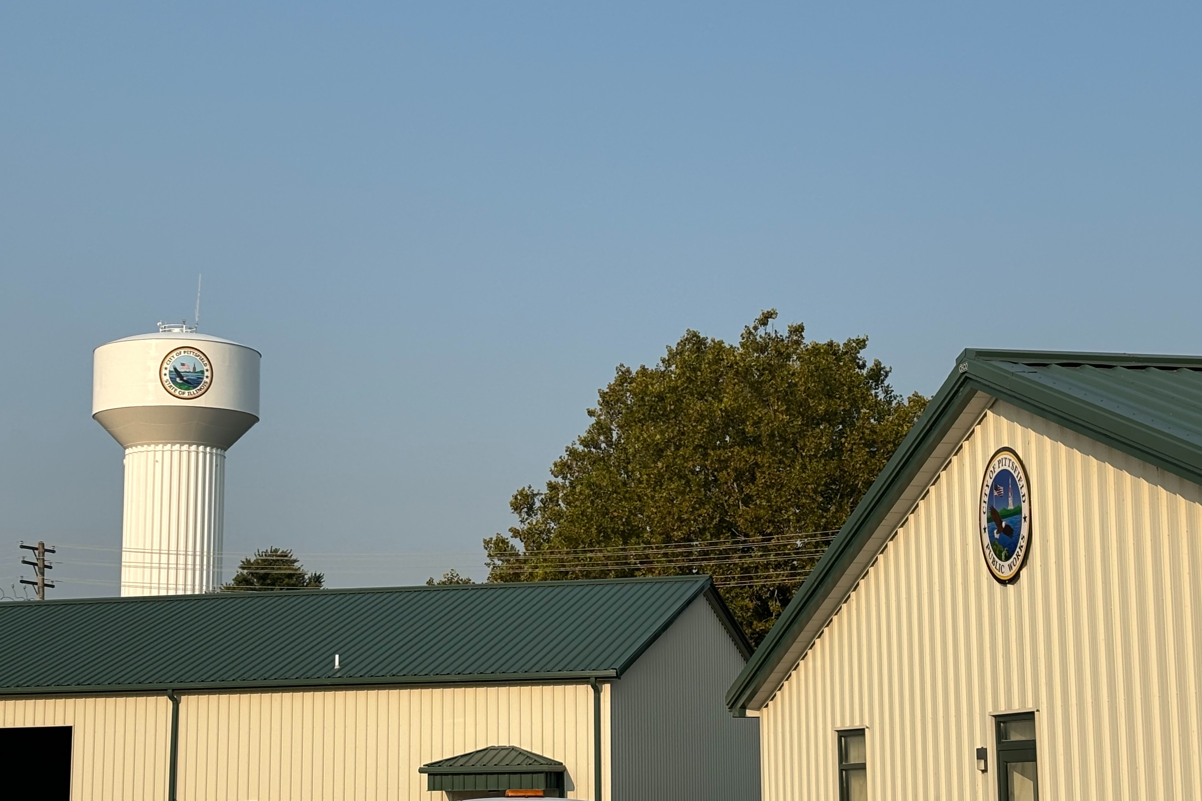 public works facility building in grassy field