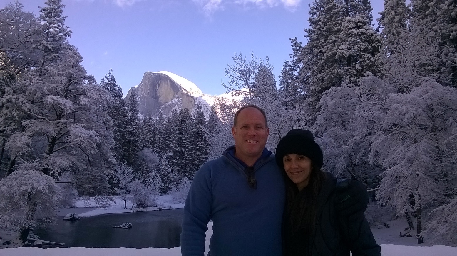 coach byrnes with his wife in a mountain