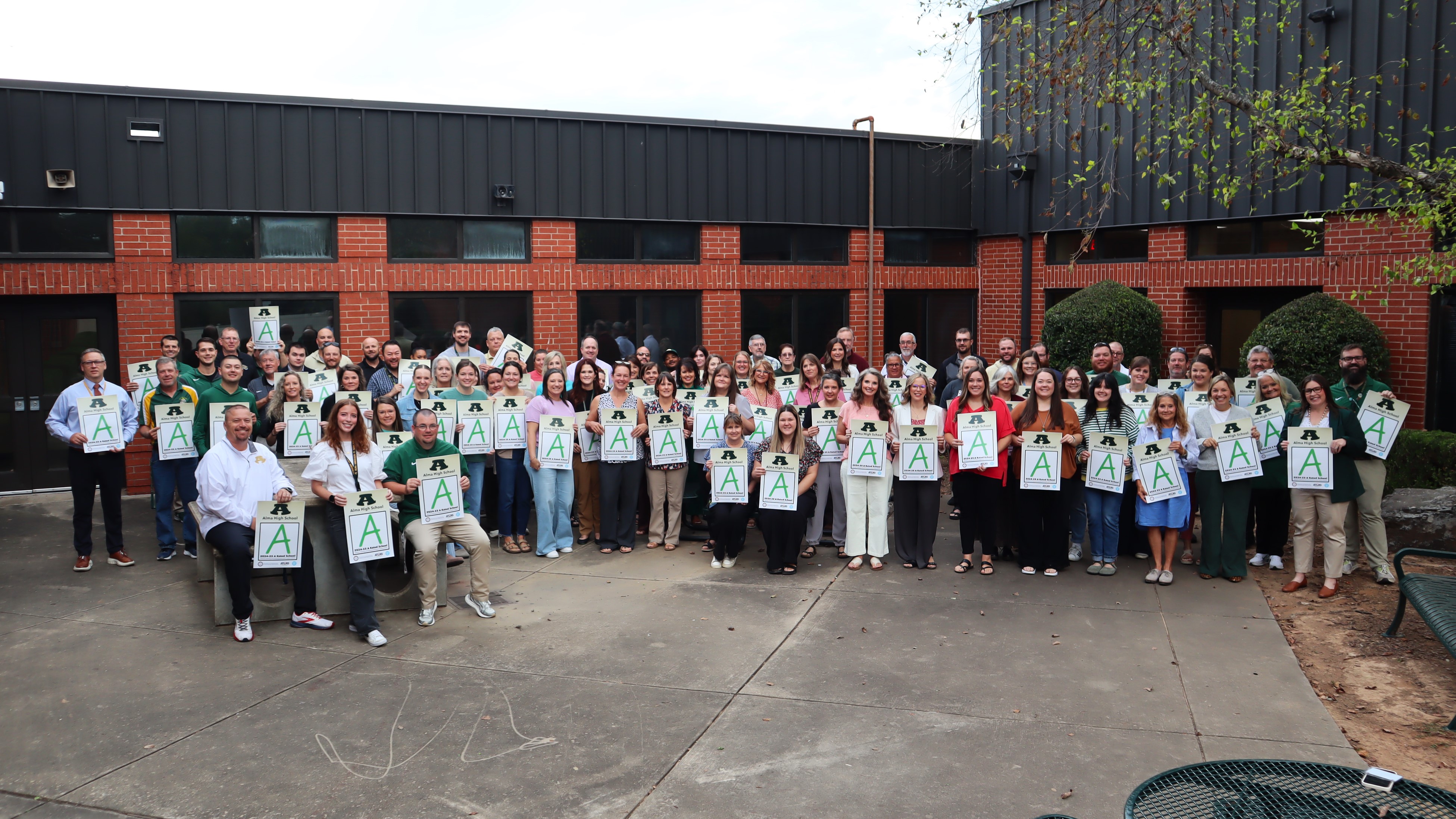 AHS STAFF WITH A POSTERS