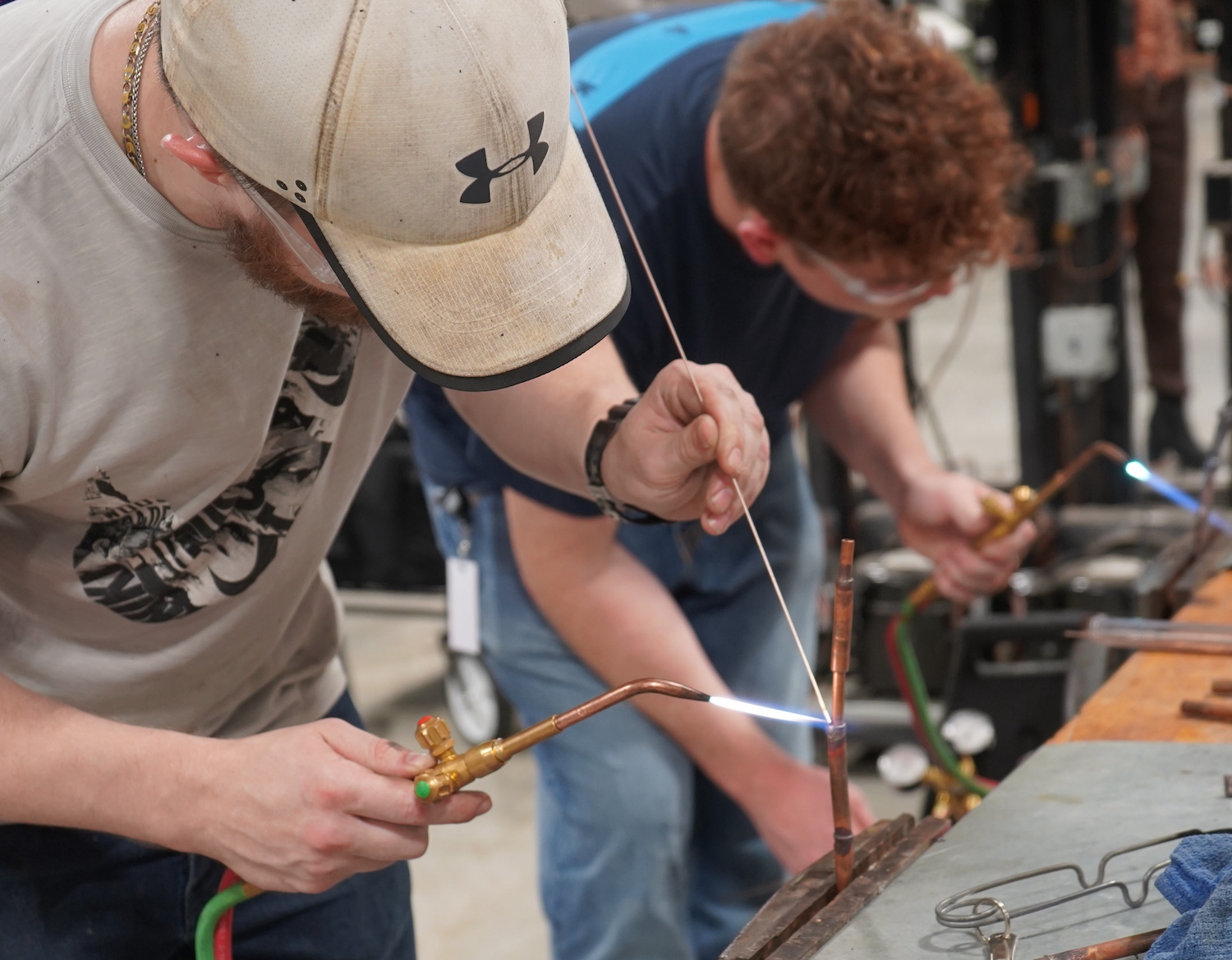 HVAC students heating up copper tubing for soldering