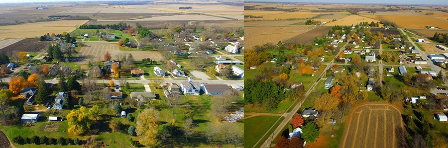 arial view of buildings, trees, and agricultural fields