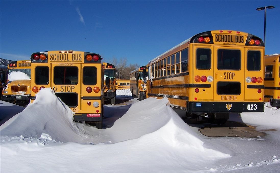 The school bus yard with snow and ice