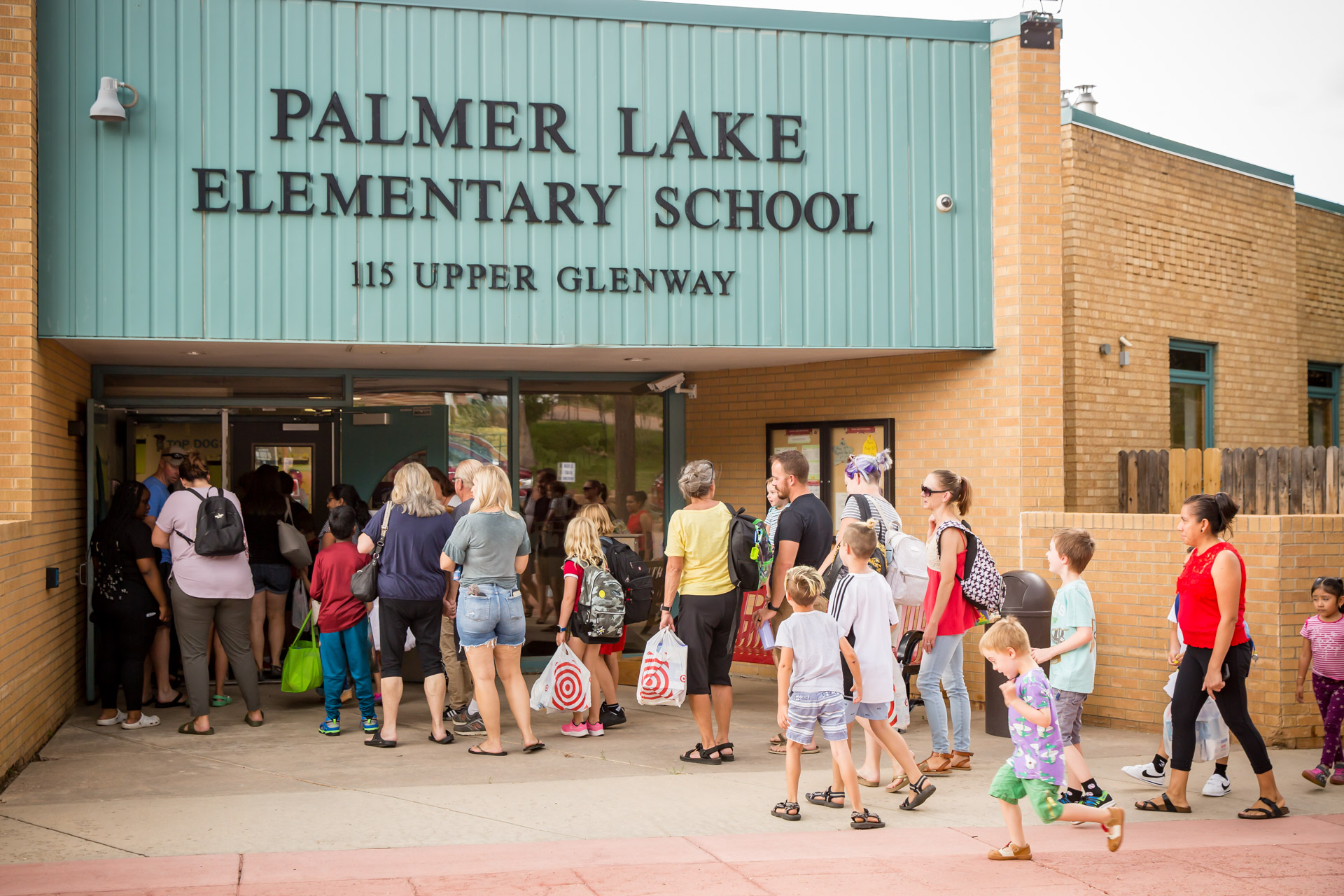 PLES families walk into the building for a visit