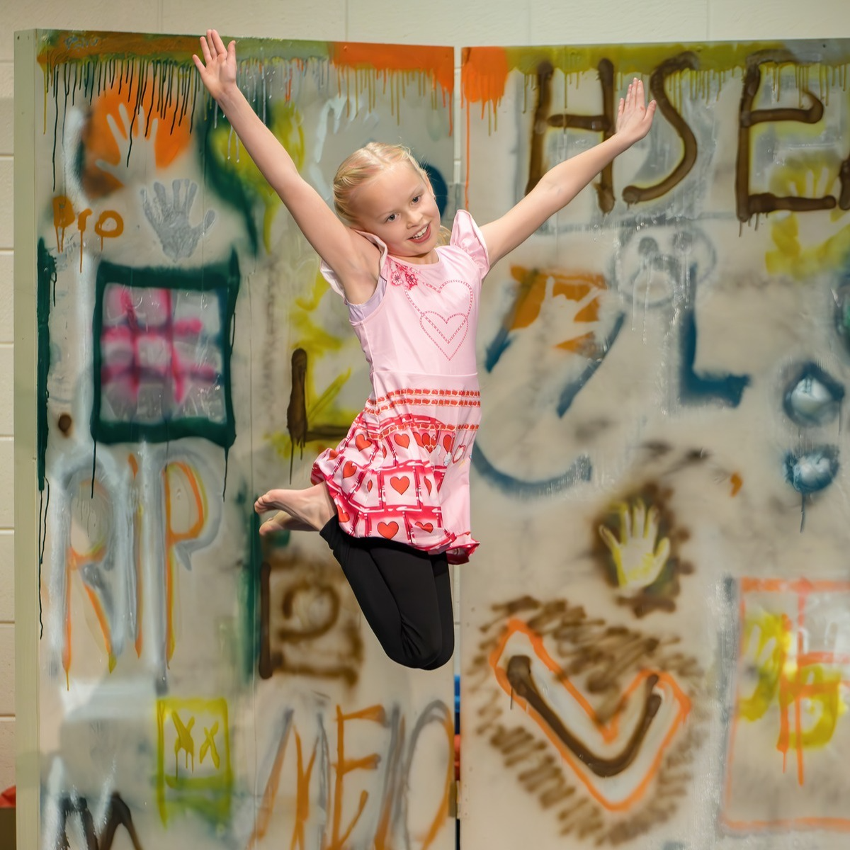 Student performs a gymnastics or dance routine.