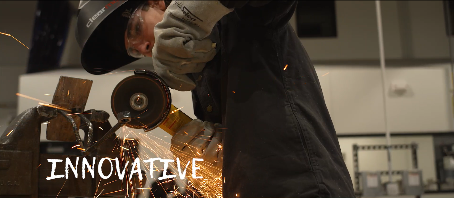 Text of the word innovative over an image of a student grinding metal in welding class