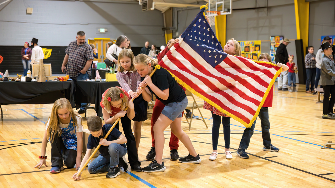 HSEA students recreate the famous statue of marines planting a flag during WWII at Iwo Jima i