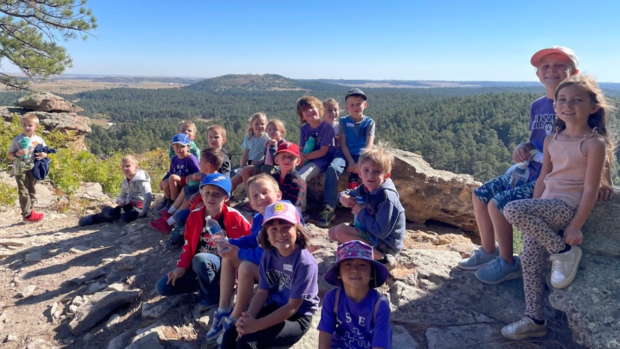 Hsea students pose for a picture while on a hike in the mountains