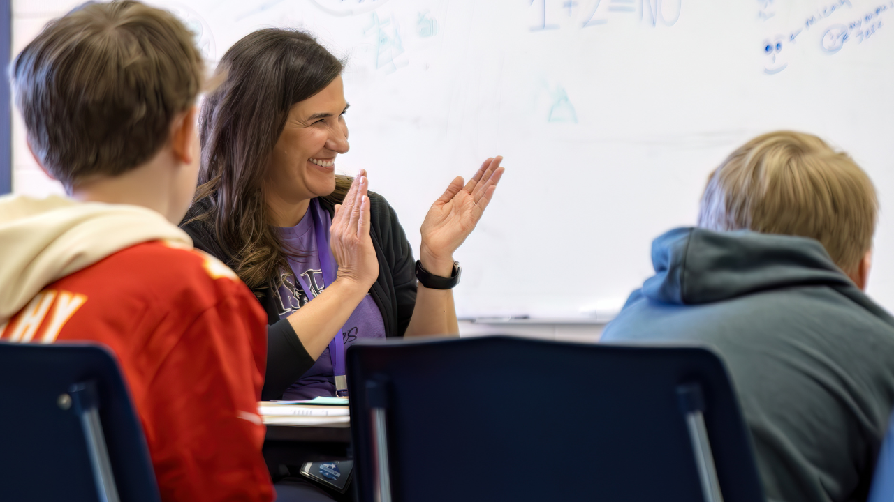 An HSEA teachers applauding students