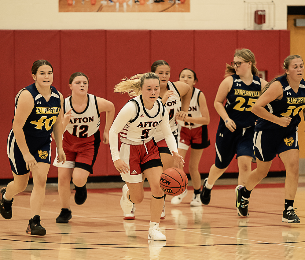 girls modified basketball in action