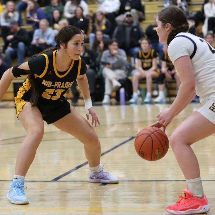 Two student playing basketball