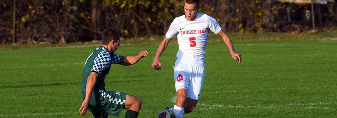 Two teen boys playing soccer