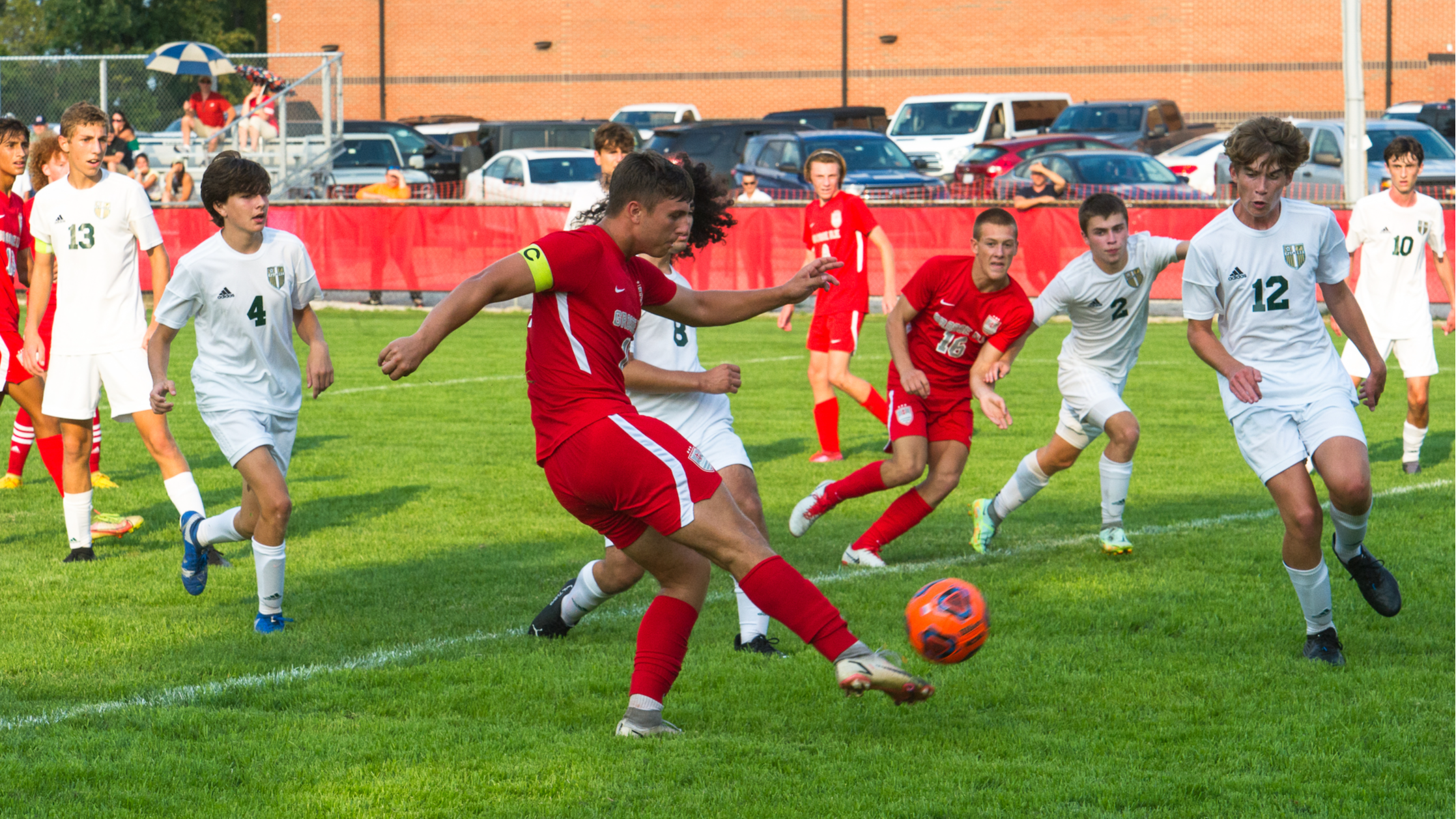 Two teen boys playing soccer