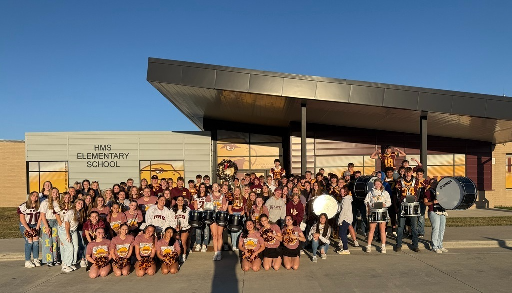 HMS High school students in fall activities at the elementary school in their uniforms