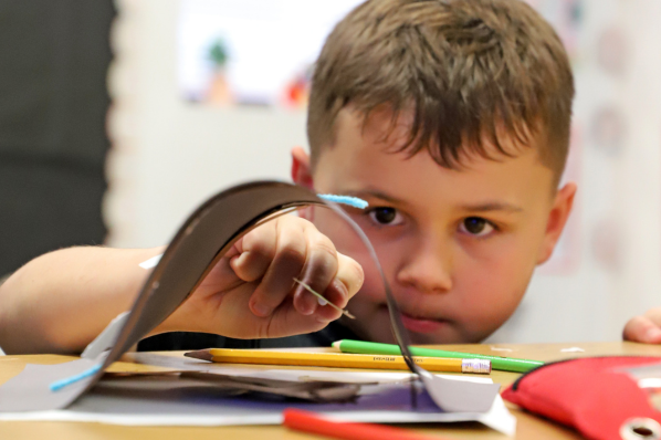 Elementary student works on a project