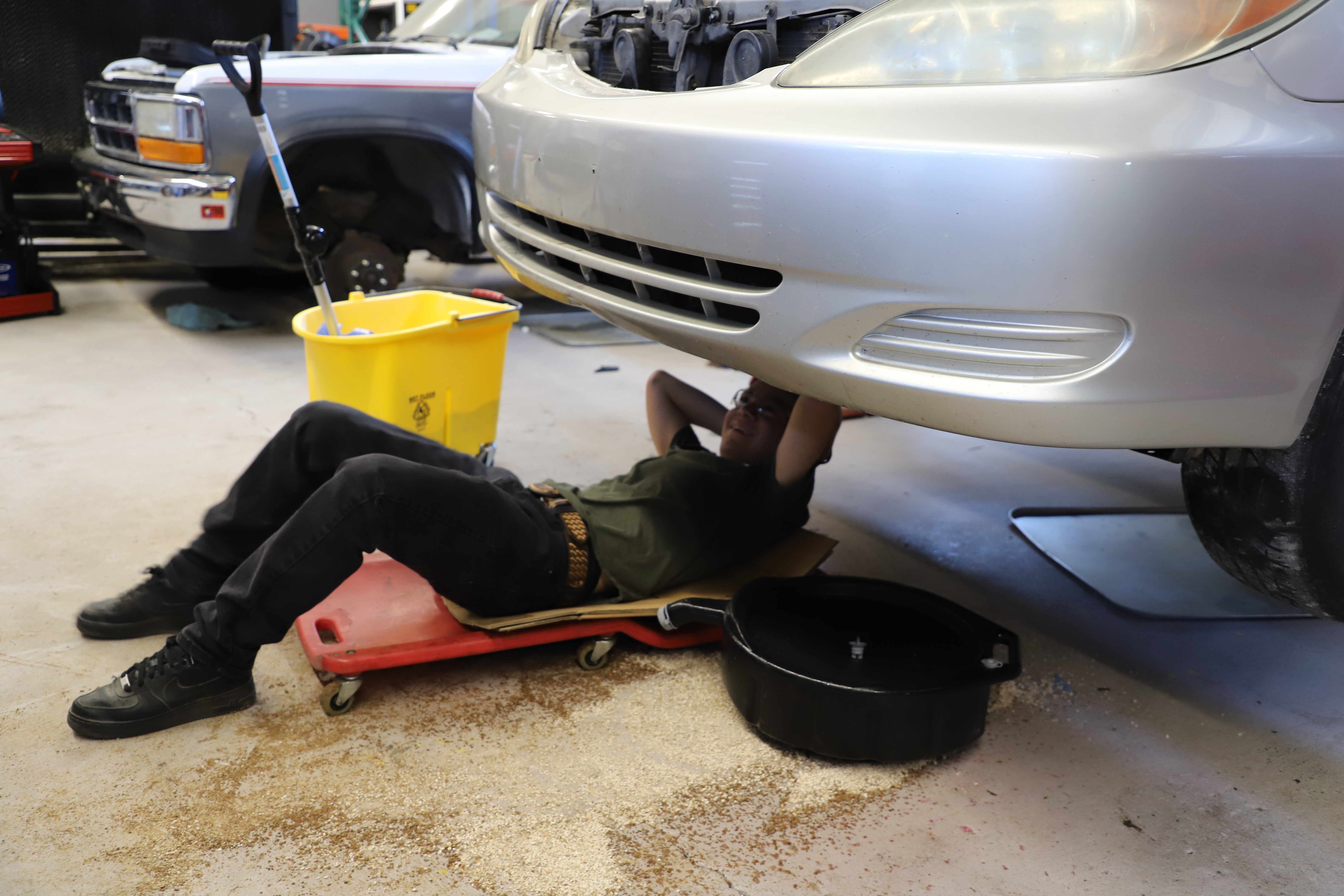 changing oil in auto shop